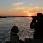 Faro Sunset Boat Tour 1 Guests enjoying the Sunset on our Ria Formosa Eco Boat Tours from Faro, Algarve - Portugal
